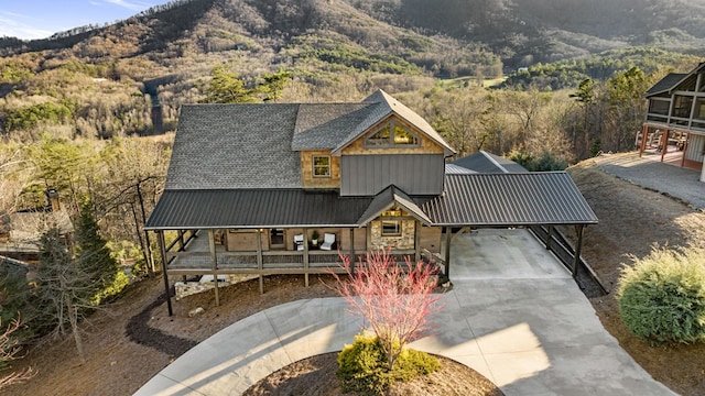 view of front of house with covered porch and a mountain view