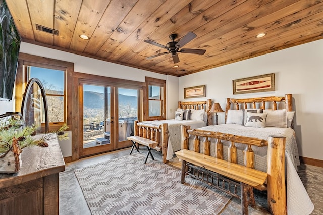 bedroom with access to outside, french doors, a mountain view, ceiling fan, and wooden ceiling