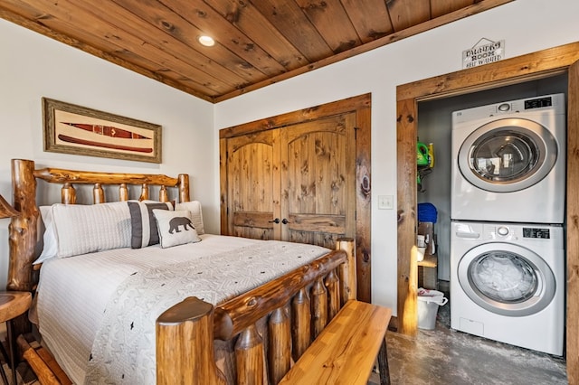 bedroom with stacked washer and clothes dryer, wood ceiling, and ornamental molding