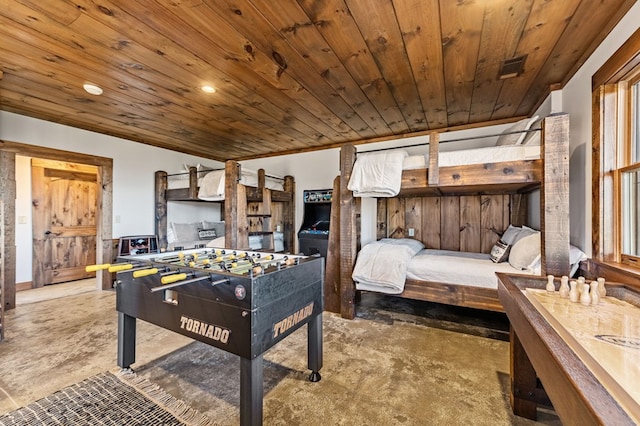 recreation room featuring wooden ceiling and dark colored carpet