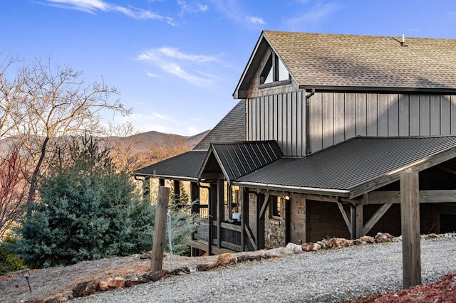 view of property exterior featuring a mountain view