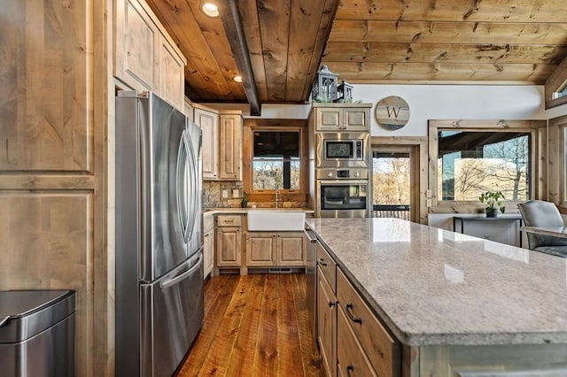 kitchen with sink, a center island, beamed ceiling, wood ceiling, and appliances with stainless steel finishes