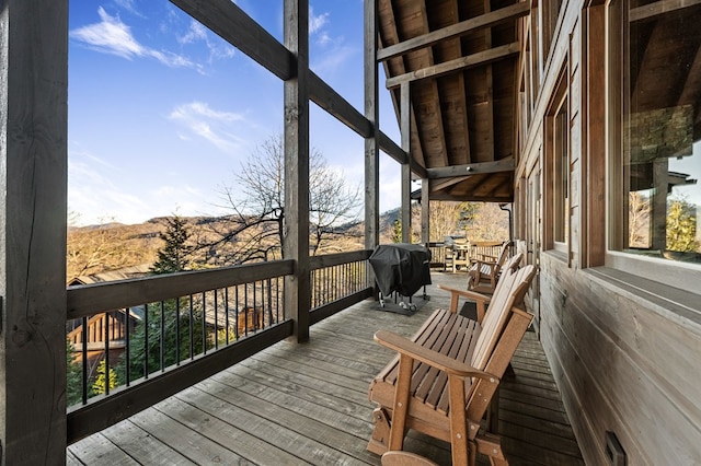 wooden deck featuring area for grilling