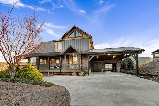 view of front of house featuring a porch and a carport