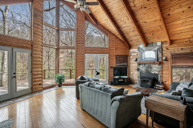 living room with beam ceiling, french doors, wooden ceiling, and wood-type flooring