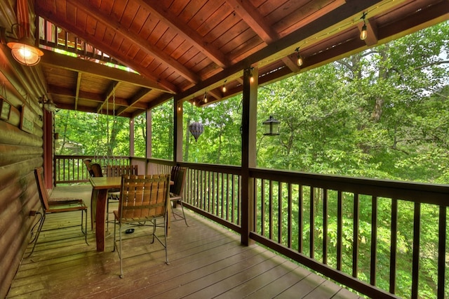 deck with outdoor dining area