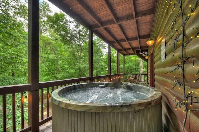 deck featuring a hot tub