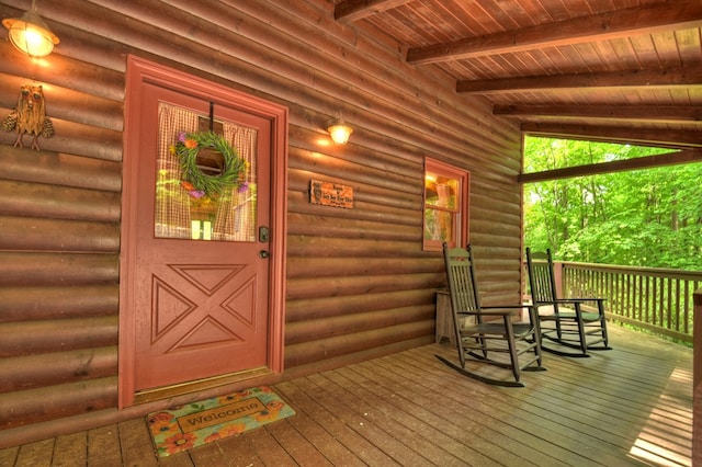 property entrance featuring log veneer siding