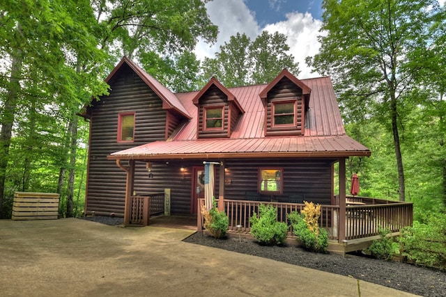 cabin featuring metal roof