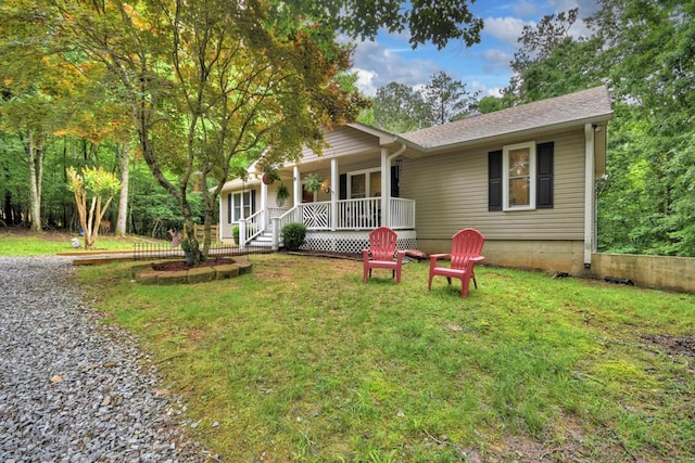 27 Ivy St, Ellijay, GA 30540 - view of front facade featuring covered porch, a front lawn, and a shingled roof