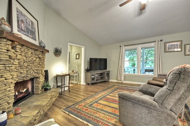 27 Ivy St, Ellijay, GA 30540 - living area featuring wood finished floors, a ceiling fan, a fireplace, and high vaulted ceiling