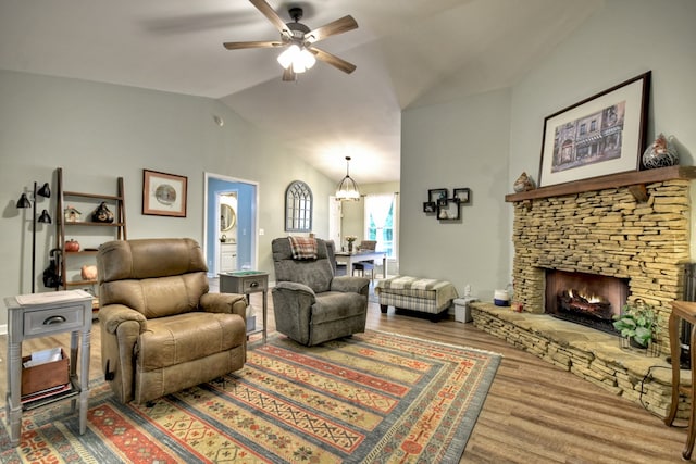 27 Ivy St, Ellijay, GA 30540 - living area featuring wood finished floors, ceiling fan, a chandelier, lofted ceiling, and a fireplace