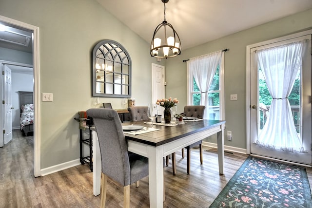 27 Ivy St, Ellijay, GA 30540 - dining space with wood finished floors, baseboards, a chandelier, and lofted ceiling