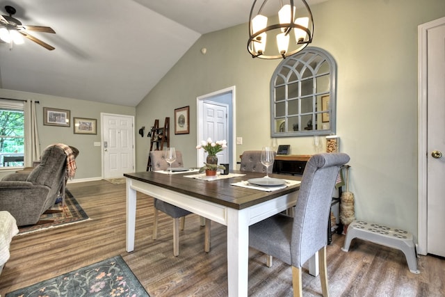 27 Ivy St, Ellijay, GA 30540 - dining space featuring wood finished floors, lofted ceiling, ceiling fan, a chandelier, and baseboards