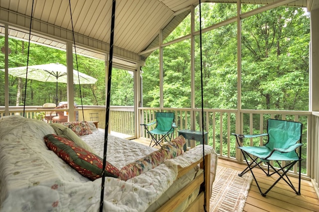 27 Ivy St, Ellijay, GA 30540 - sunroom featuring lofted ceiling, outdoor lounge area, and a view of trees