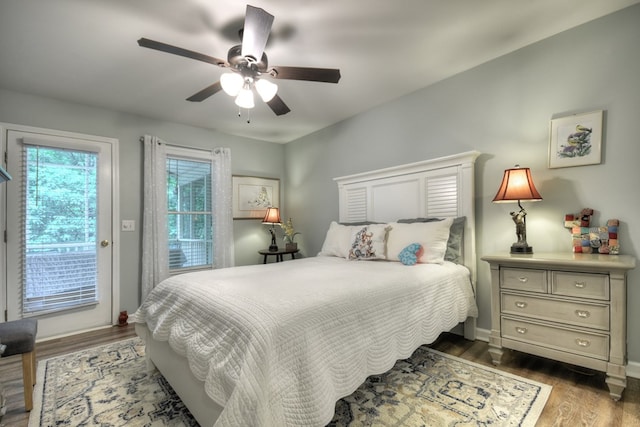 27 Ivy St, Ellijay, GA 30540 - bedroom featuring access to exterior, wood finished floors, a ceiling fan, and baseboards