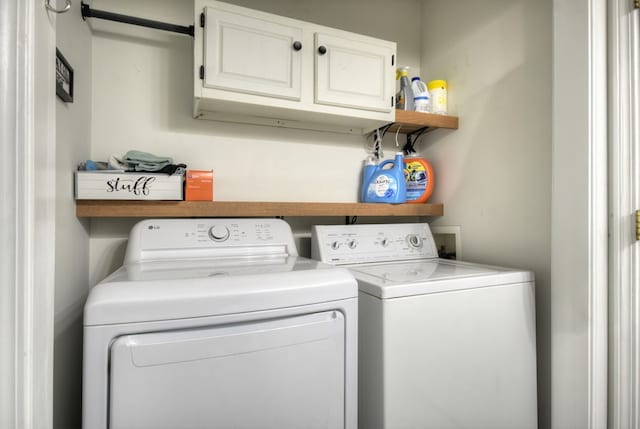 27 Ivy St, Ellijay, GA 30540 - laundry room featuring cabinet space and washer and dryer