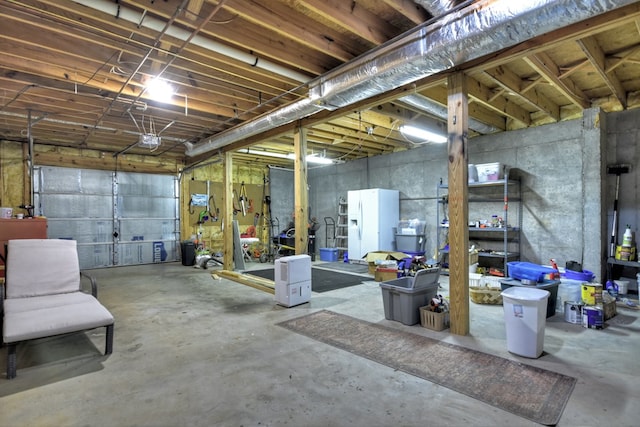 27 Ivy St, Ellijay, GA 30540 - garage with white refrigerator with ice dispenser