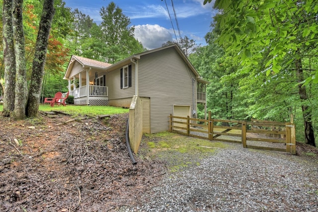 27 Ivy St, Ellijay, GA 30540 - view of home's exterior with an attached garage, a porch, and driveway