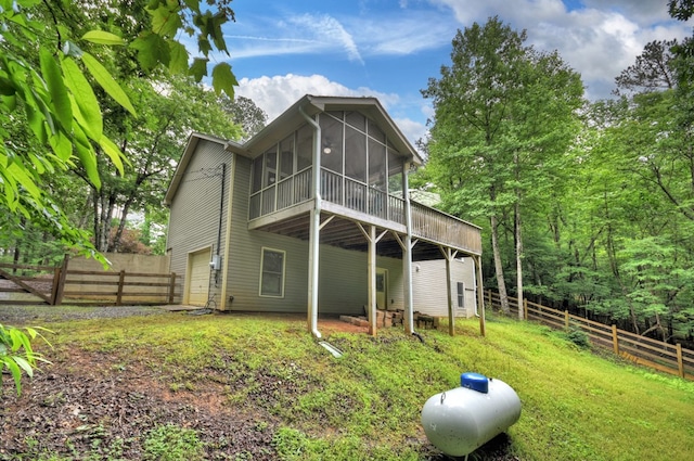27 Ivy St, Ellijay, GA 30540 - rear view of house with a sunroom and a garage