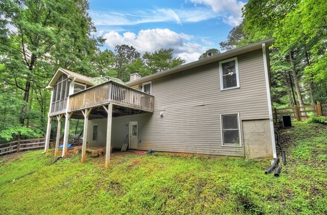 27 Ivy St, Ellijay, GA 30540 - back of property with a wooden deck and central AC