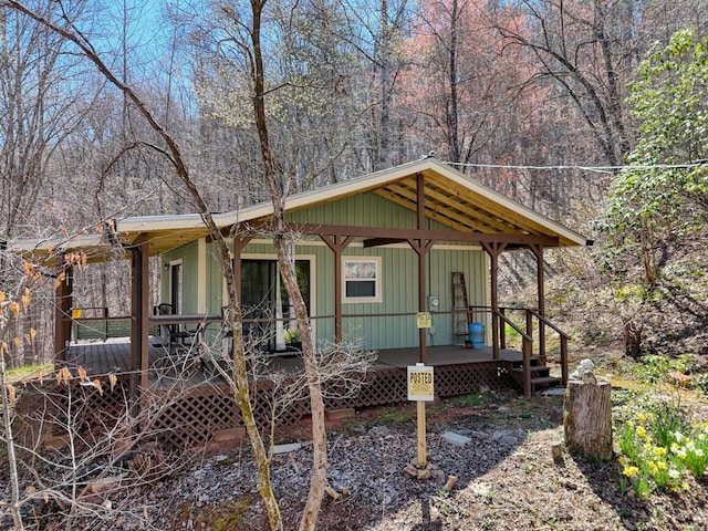 526 Garland Ridge Dr, Hayesville, NC 28904 - view of front of house featuring covered porch and a wooded view