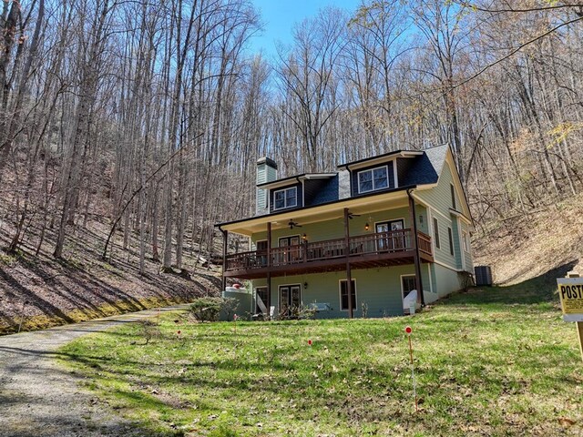 526 Garland Ridge Dr, Hayesville, NC 28904 - rear view of house featuring a chimney, cooling unit, ceiling fan, and a yard