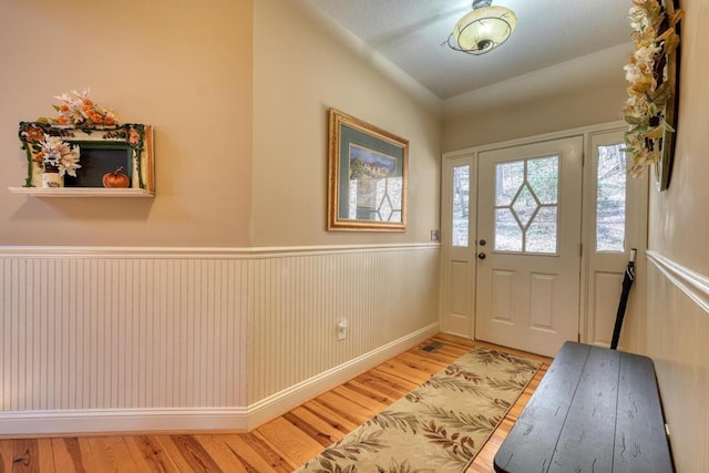 526 Garland Ridge Dr, Hayesville, NC 28904 - foyer entrance featuring wainscoting and wood finished floors