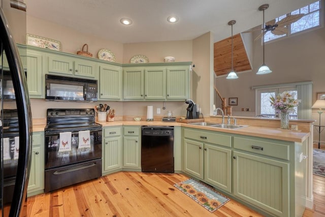 526 Garland Ridge Dr, Hayesville, NC 28904 - kitchen featuring a sink, pendant lighting, green cabinets, a peninsula, and black appliances