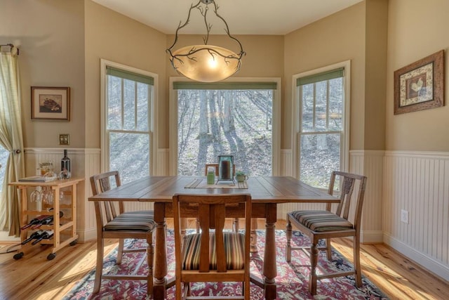 526 Garland Ridge Dr, Hayesville, NC 28904 - dining room with a wainscoted wall and light wood-style floors