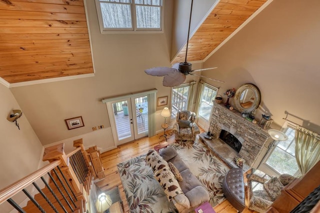 526 Garland Ridge Dr, Hayesville, NC 28904 - living area with crown molding, a fireplace, wood finished floors, a high ceiling, and french doors