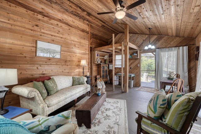 526 Garland Ridge Dr, Hayesville, NC 28904 - living area featuring concrete flooring, lofted ceiling, wood ceiling, wooden walls, and ceiling fan