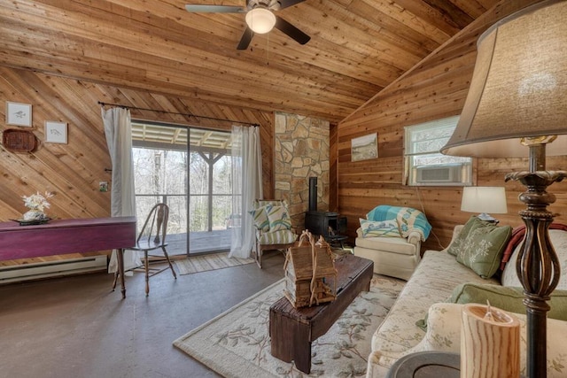 526 Garland Ridge Dr, Hayesville, NC 28904 - living area with cooling unit, a healthy amount of sunlight, vaulted ceiling, and a wood stove