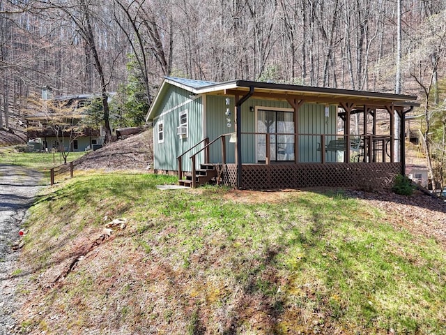 526 Garland Ridge Dr, Hayesville, NC 28904 - view of front of property featuring a wooded view, entry steps, and a front lawn