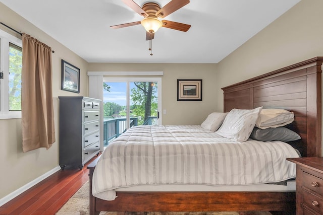 bedroom featuring access to outside, baseboards, dark wood-type flooring, and ceiling fan