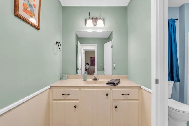 bathroom featuring toilet and vanity