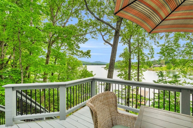 deck featuring a water and mountain view