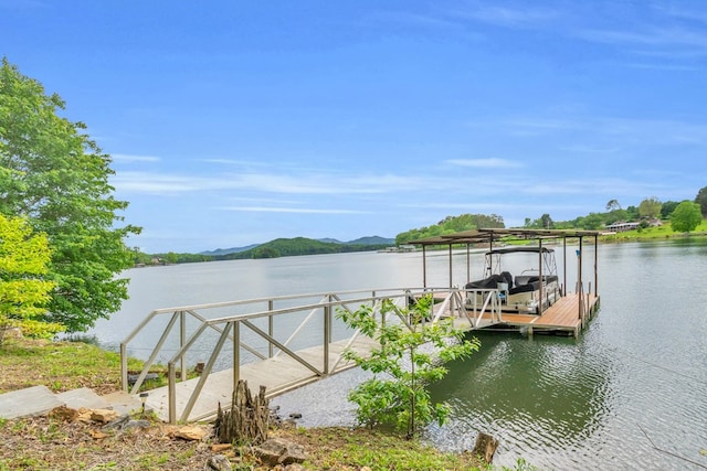 dock with a water and mountain view and boat lift