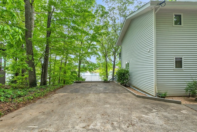 view of side of home featuring a water view