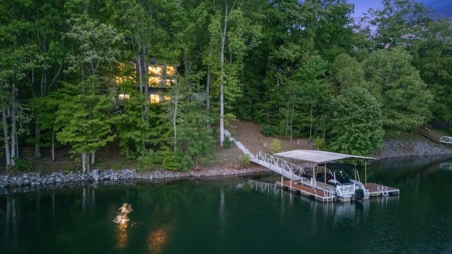 dock with a water view and a view of trees
