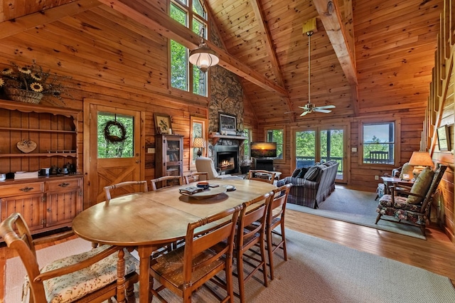 35 The Blf, Morganton, GA 30560 - dining area featuring healthy amount of natural light, a fireplace, beam ceiling, high vaulted ceiling, and light wood-style flooring