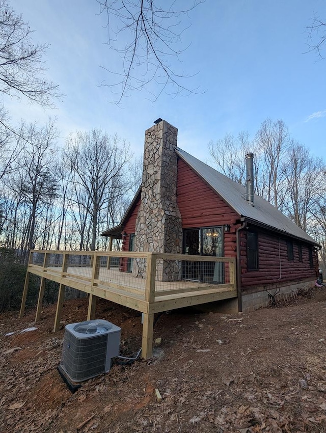 exterior space with a deck and central air condition unit