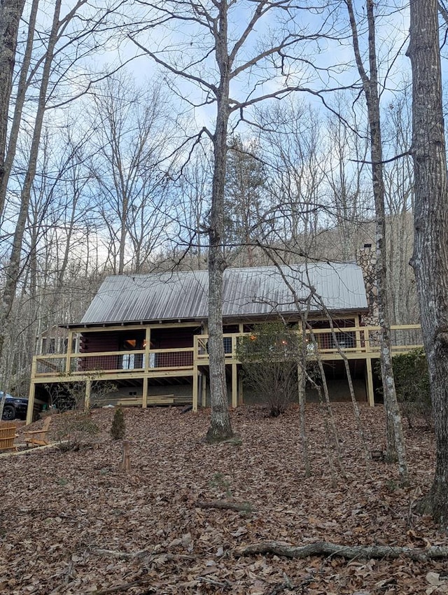 back of property with a wooden deck