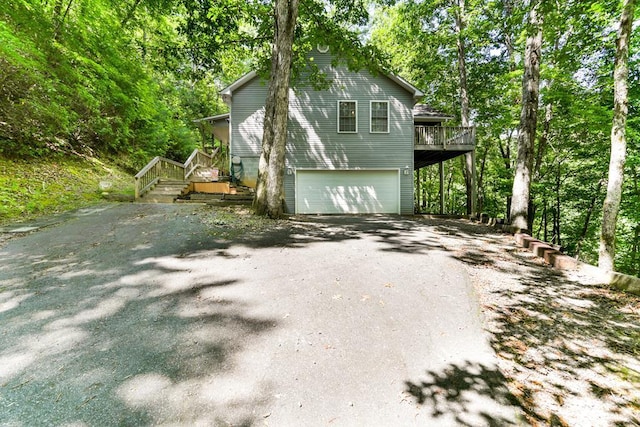 view of side of property with a garage