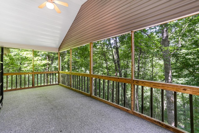 unfurnished sunroom featuring lofted ceiling and ceiling fan