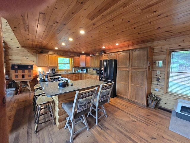 1102 Summit Way, Blairsville, GA 30512 - kitchen featuring stainless steel fridge, a sink, recessed lighting, a kitchen bar, and light wood finished floors