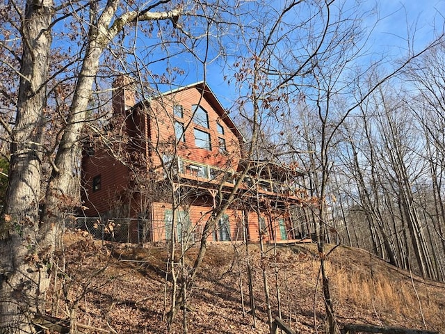 1102 Summit Way, Blairsville, GA 30512 - back of house featuring a chimney and fence