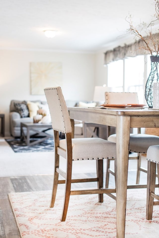 dining area with wood finished floors