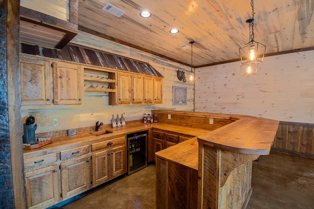 340 Hooch Holler Ln, Morganton, GA 30560 - kitchen featuring wine cooler, finished concrete floors, butcher block countertops, wood walls, and a sink
