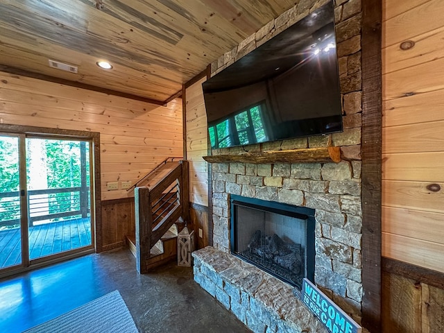 340 Hooch Holler Ln, Morganton, GA 30560 - unfurnished living room featuring wooden walls, wooden ceiling, healthy amount of natural light, concrete flooring, and a fireplace